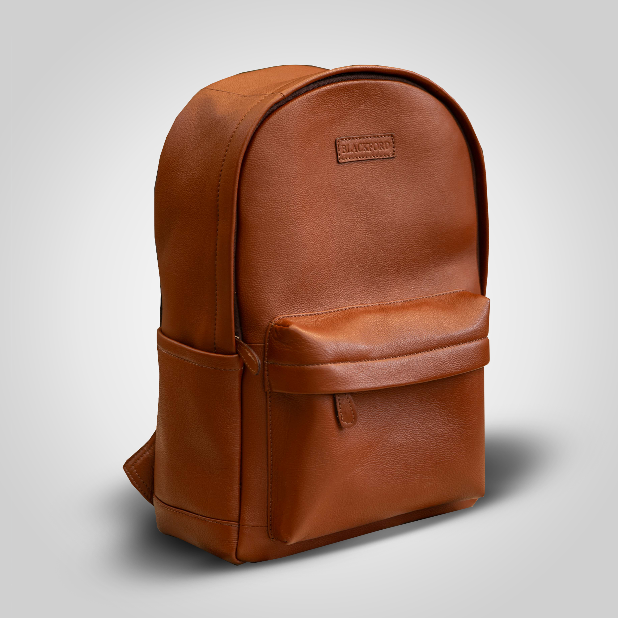 Brown leather backpack on a light gray background